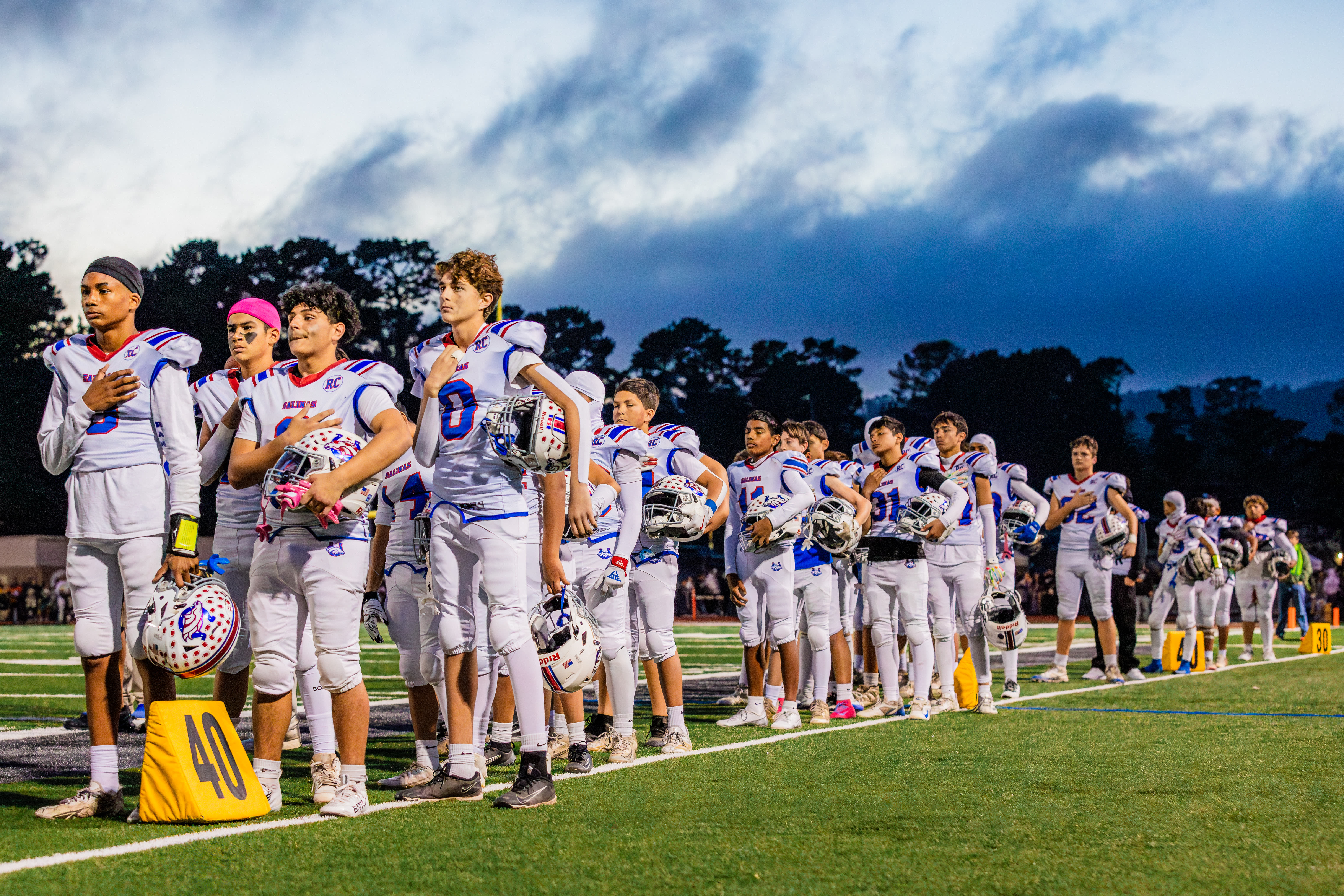 SCB Football players lined up during the anthem